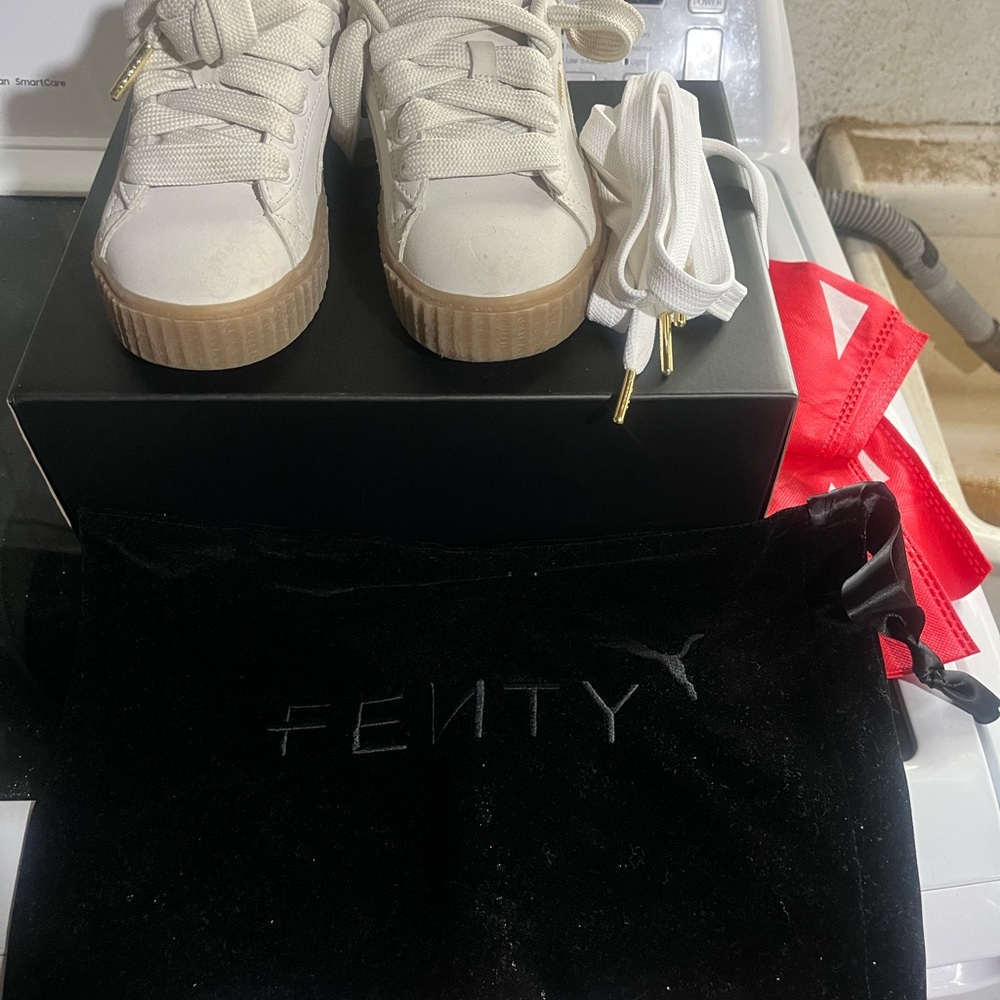 Fenty White Sneakers with Gold Accents